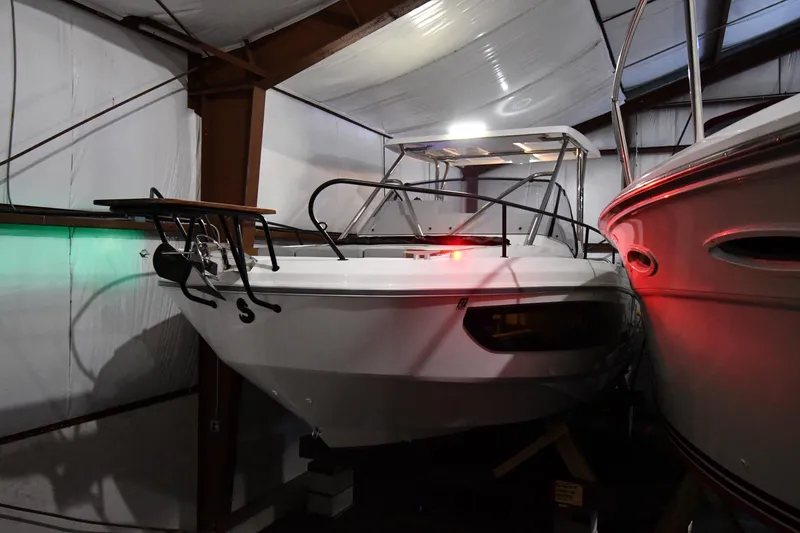 Slide: The Image of 2023 Beneteau Flyer 9 SUNdeck boat in storage, indoor lighting. - 12