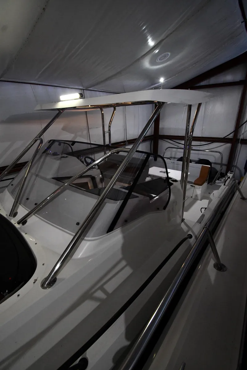 Slide: The Image of 2023 Beneteau Flyer 9 SUNdeck boat in storage, featuring sleek design and modern amenities. - 13