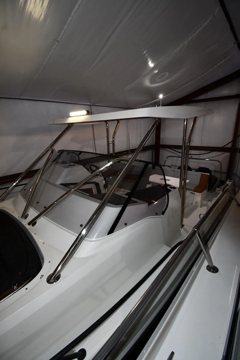 Slide: The Image of 2023 Beneteau Flyer 9 SUNdeck boat in storage, showcasing sleek design and modern features. - 14