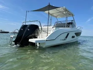 Slide: The Image of 2023 Beneteau Flyer 9 SUNdeck boat on clear water, rear view. - 2