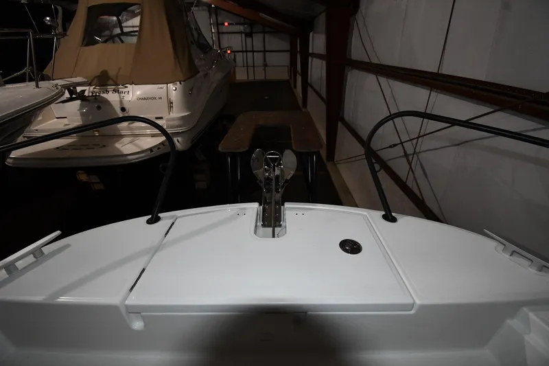 Slide: The Image of 2023 Beneteau Flyer 9 SUNdeck in a dimly lit storage area. - 20