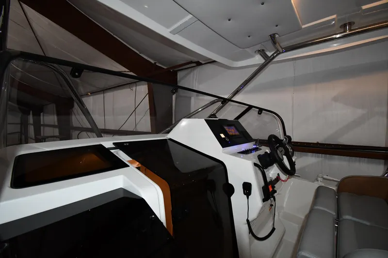 Slide: The Image of 2023 Beneteau Flyer 9 SUNdeck cockpit with modern controls and seating. - 24