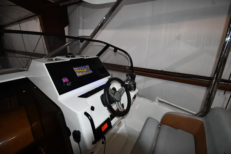 Slide: The Image of 2023 Beneteau Flyer 9 SUNdeck helm with modern controls and navigation display. - 25