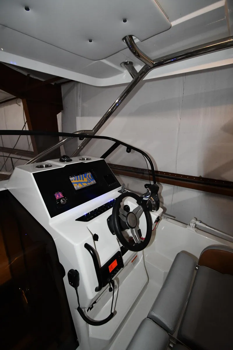 Slide: The Image of 2023 Beneteau Flyer 9 SUNdeck cockpit with modern steering and controls. - 26