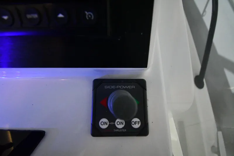 Slide: The Image of Control panel on 2023 Beneteau Flyer 9 SUNdeck boat, featuring Side-Power thruster switch. - 29
