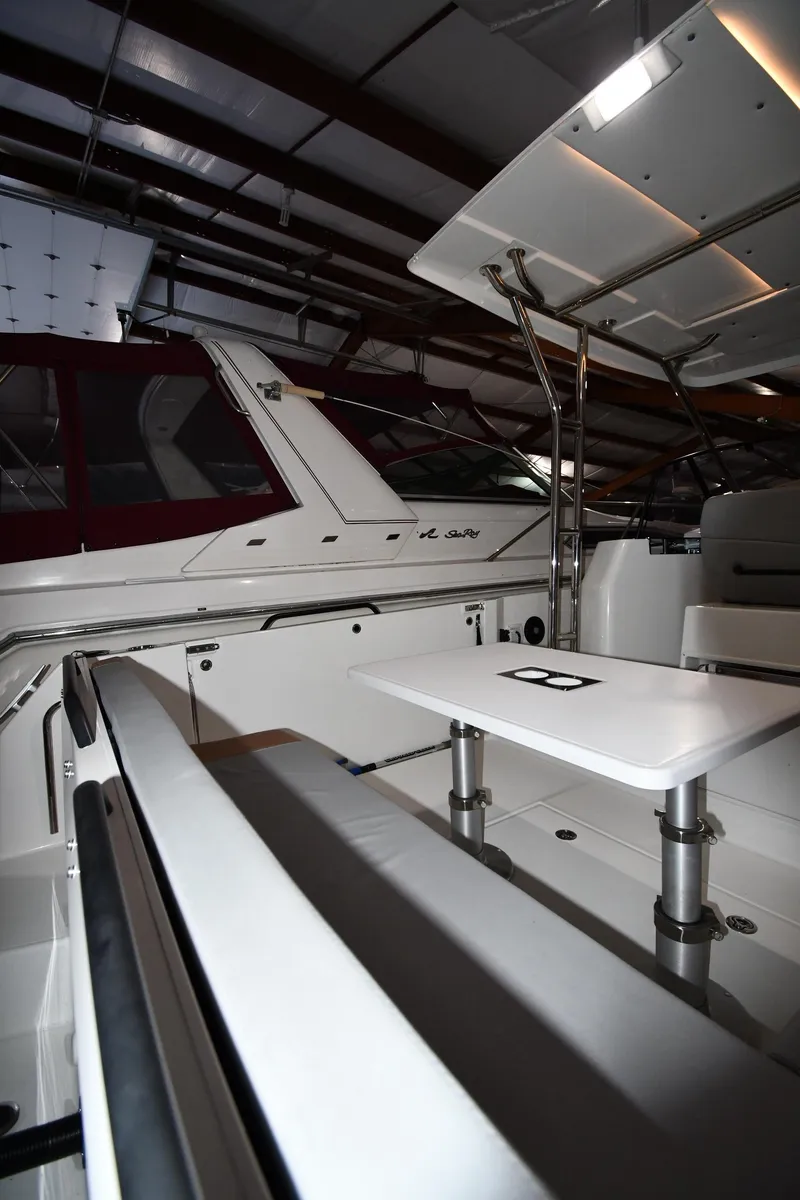 Slide: The Image of 2023 Beneteau Flyer 9 SUNdeck interior with seating and table in a showroom. - 38