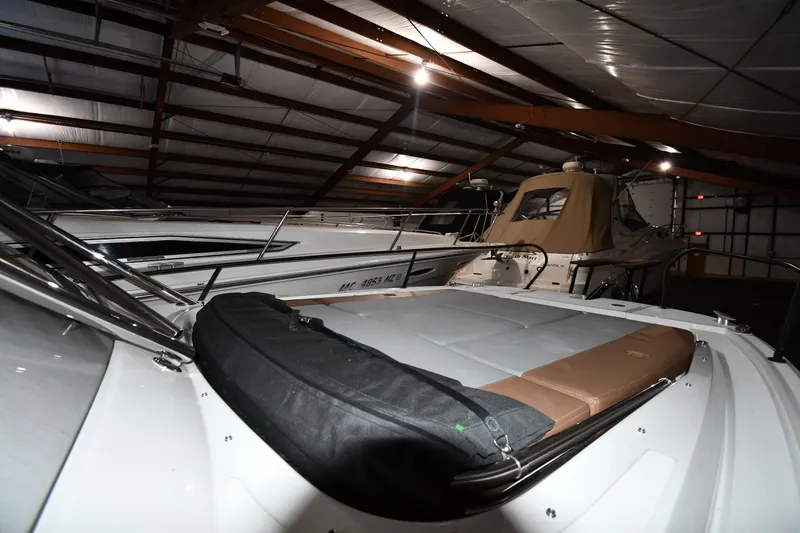 Slide: The Image of 2023 Beneteau Flyer 9 SUNdeck in a dimly lit storage facility. - 46