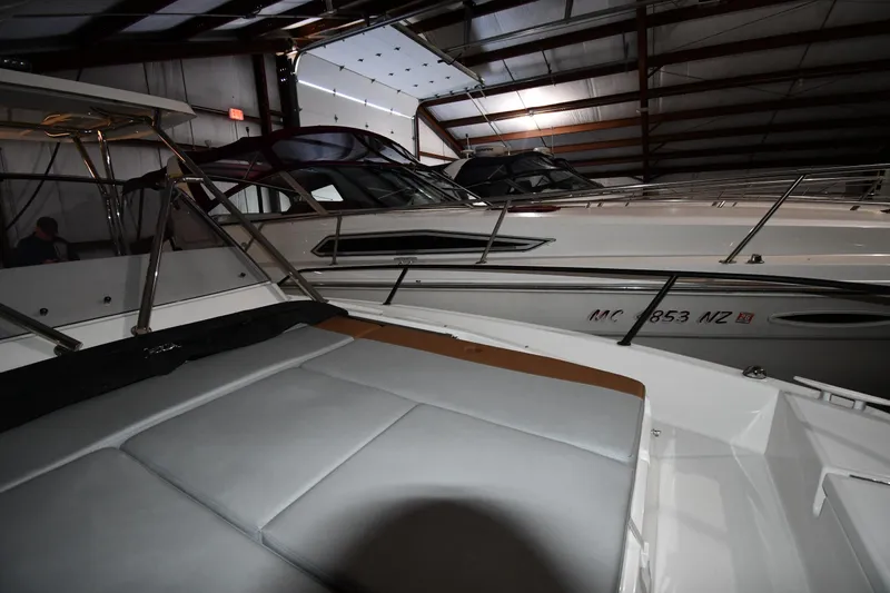Slide: The Image of 2023 Beneteau Flyer 9 SUNdeck in a dimly lit indoor marina. - 47