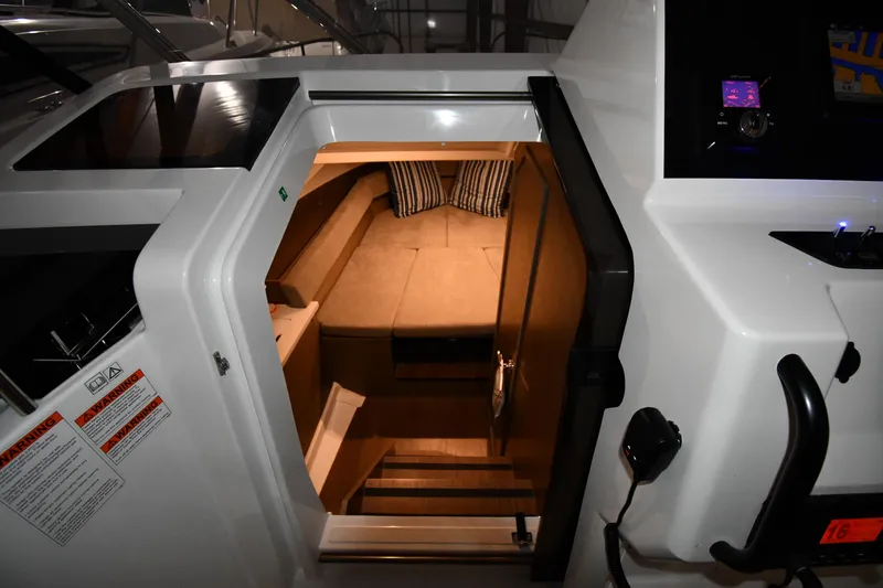 Slide: The Image of 2023 Beneteau Flyer 9 SUNdeck cabin interior with cozy bedding and ambient lighting. - 49
