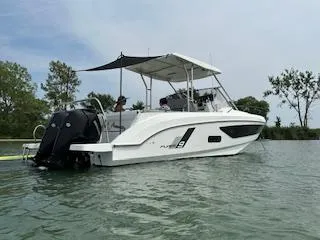 Slide: The Image of 2023 Beneteau Flyer 9 SUNdeck boat on water, side view with canopy. - 5