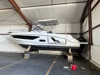 Slide: The Image of 2023 Beneteau Flyer 9 SUNdeck boat stored indoors on supports. - 7