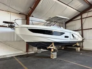 Slide: The Image of 2023 Beneteau Flyer 9 SUNdeck boat in storage, showcasing sleek design and modern features. - 8
