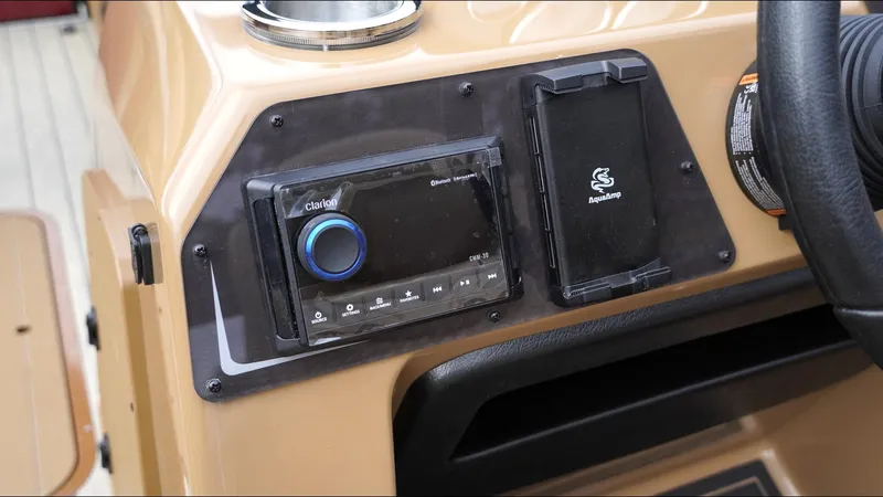 Slide: The Image of 2025 SunCatcher Fusion 324SS dashboard with Clarion audio system and AquaAmp panel. - 10