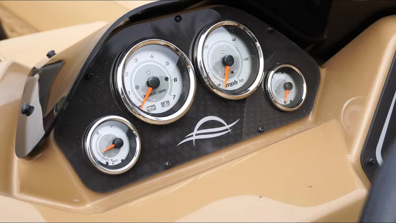 Slide: The Image of Dashboard of 2025 SunCatcher Fusion 324SS with speedometer and tachometer gauges. - 11