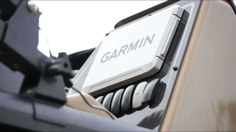 Slide: The Image of Garmin device on 2025 SunCatcher Fusion 324SS boat dashboard. - 12