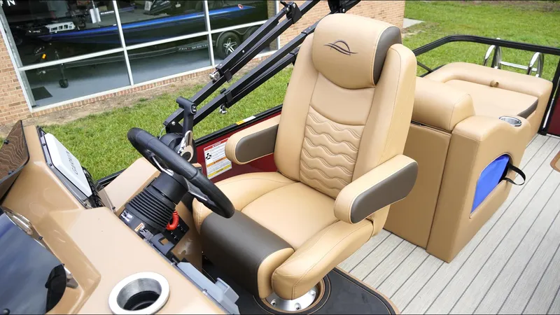 Slide: The Image of Luxurious interior of 2025 SunCatcher Fusion 324SS boat with tan captain's chair. - 13