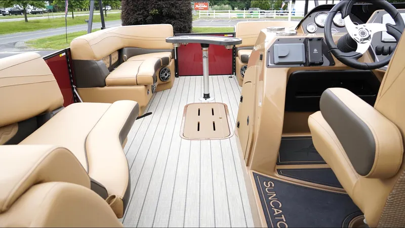 Slide: The Image of Interior of 2025 SunCatcher Fusion 324SS boat with luxurious seating and modern dashboard. - 14