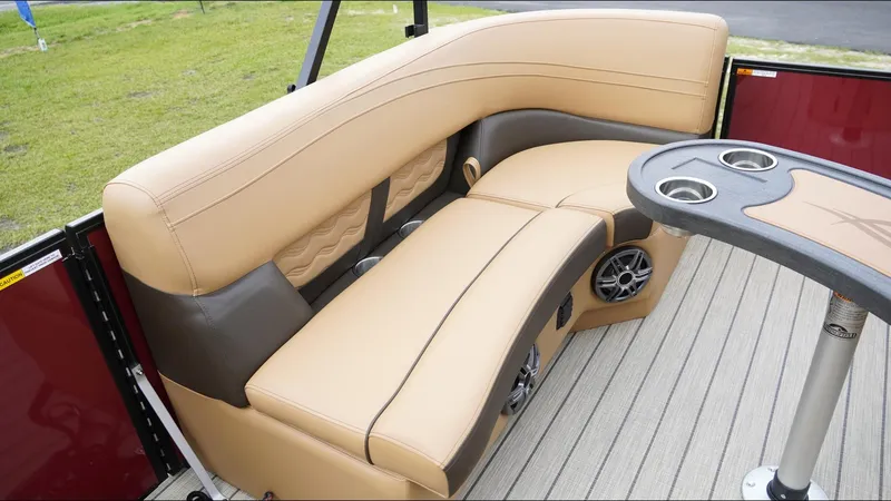 Slide: The Image of Luxurious seating on 2025 SunCatcher Fusion 324SS boat with cup holders and speakers. - 16