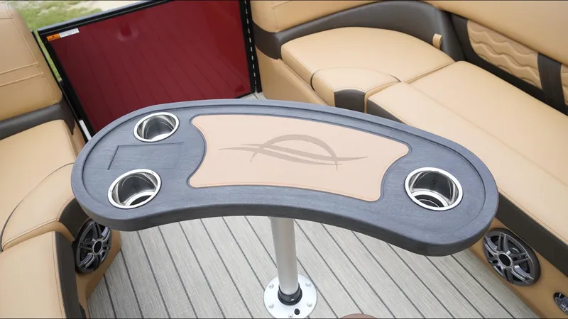 Slide: The Image of Luxurious seating and table on 2025 SunCatcher Fusion 324SS boat interior. - 20