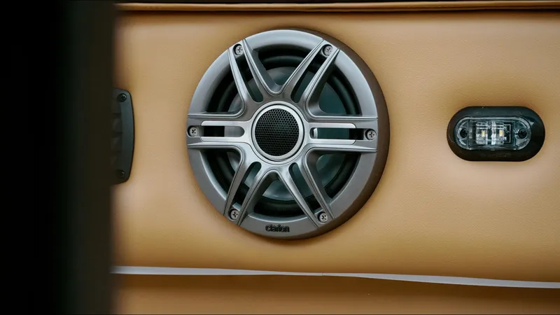 Slide: The Image of Speaker and light detail on 2025 SunCatcher Fusion 324SS boat interior. - 21