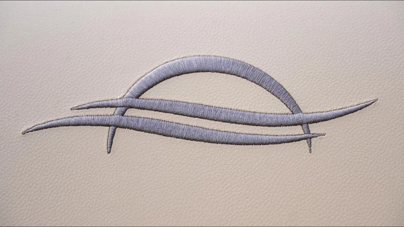 Slide: The Image of Embroidered logo on SunCatcher Fusion 324SS 2025 boat upholstery. - 22