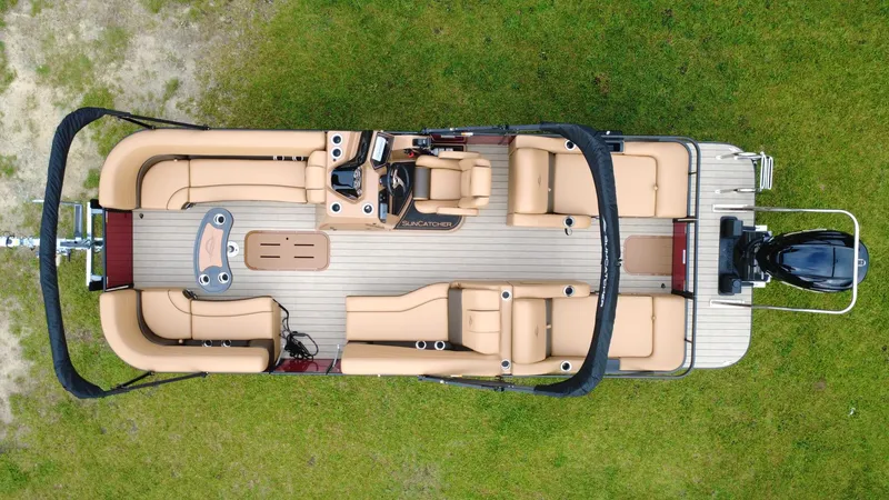 Slide: The Image of Overhead view of 2025 SunCatcher Fusion 324SS pontoon boat on grass. - 3