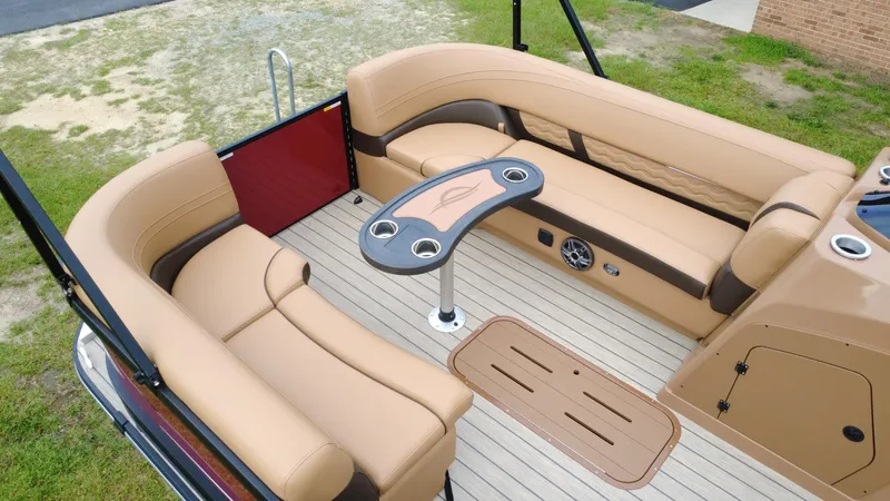 Slide: The Image of Luxurious seating area on 2025 SunCatcher Fusion 324SS pontoon boat with beige upholstery. - 4