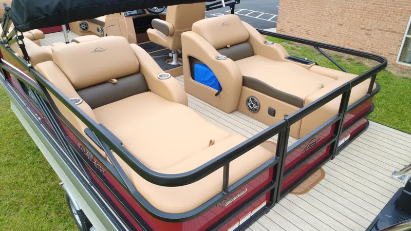 Slide: The Image of 2025 SunCatcher Fusion 324SS pontoon boat with luxurious tan seating and modern design. - 5