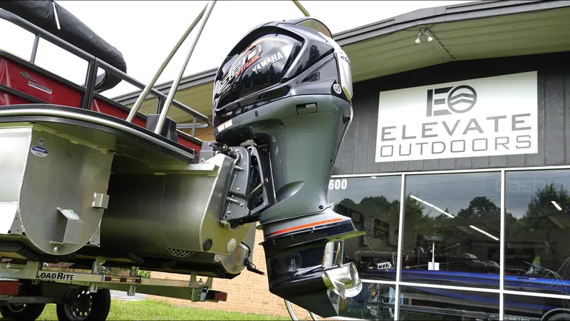 Slide: The Image of 2025 SunCatcher Fusion 324SS boat with Yamaha engine at Elevate Outdoors store. - 6