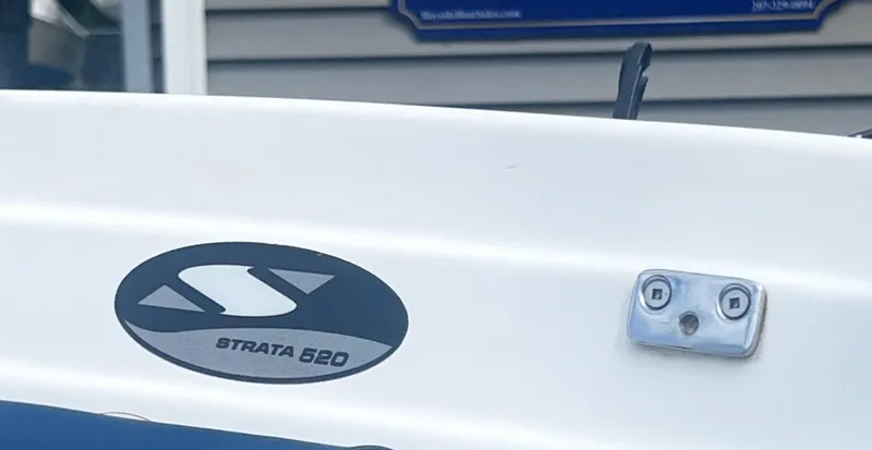 Slide: The Image of Smuggler Strata 520 boat, 2015 model, featuring logo and hardware detail. - 10