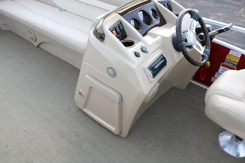 Slide: The Image of 2013 Bennington 22 SLX boat interior with steering console and seating. - 24