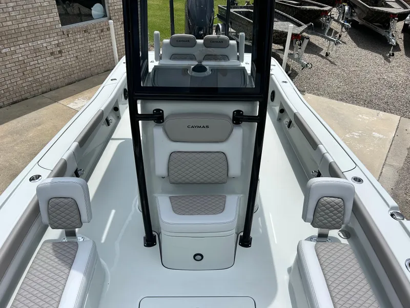 Slide: The Image of 2026 Caymas 28 HB boat interior with cushioned seating and modern design. - 11