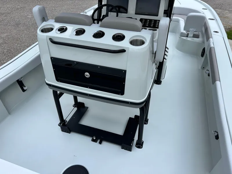 Slide: The Image of 2026 Caymas 28 HB boat interior with console and seating arrangement. - 18