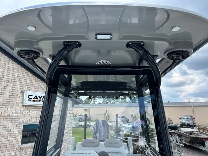Slide: The Image of 2026 Caymas 28 HB boat interior with speakers and overhead console. - 28