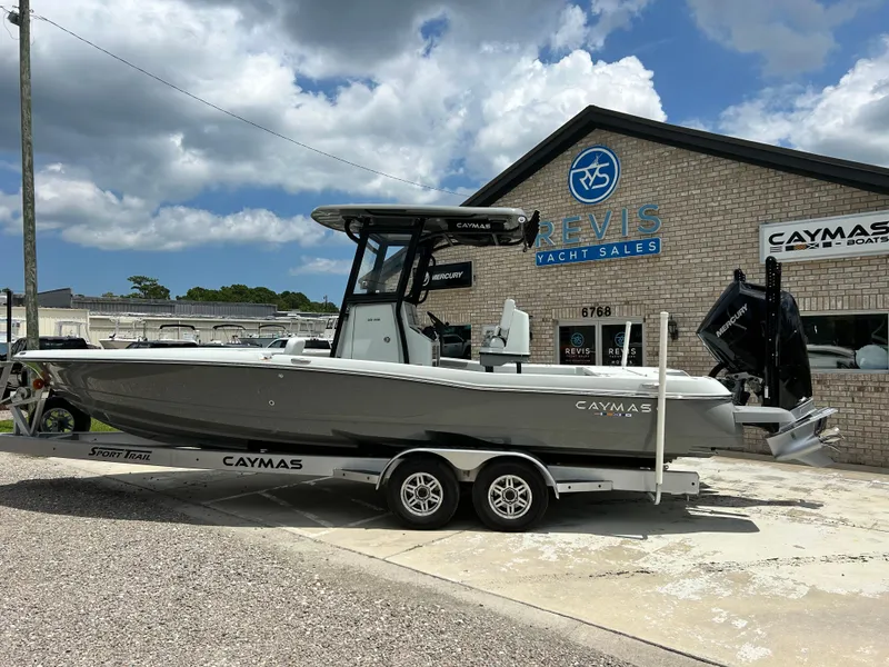 Slide: The Image of 2026 Caymas 28 HB boat on trailer at Revis Yacht Sales dealership. - 3
