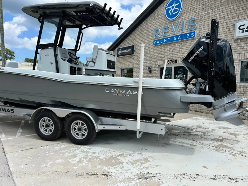 Slide: The Image of 2026 Caymas 28 HB boat at Revis Yacht Sales dealership, featuring a Mercury engine. - 4