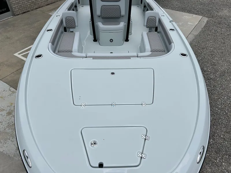 Slide: The Image of 2026 Caymas 28 HB boat deck with seating and storage compartments. - 8