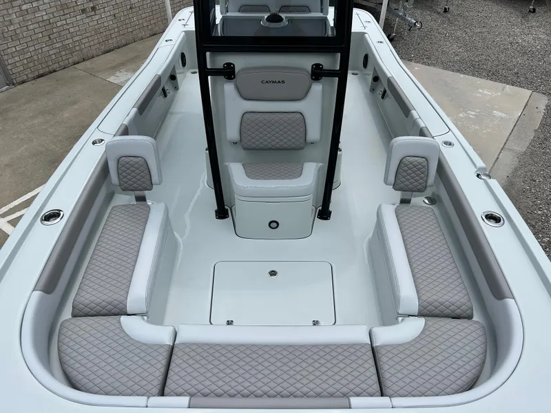 Slide: The Image of 2026 Caymas 28 HB boat interior with cushioned seating and modern design. - 9