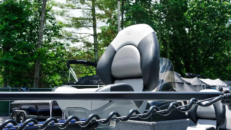 Slide: The Image of 2025 G3 Angler V164 C boat seat with lush greenery background. - 10