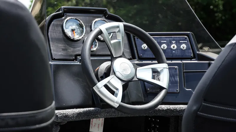 Slide: The Image of 2025 G3 Angler V164 C dashboard with steering wheel and gauges. - 11