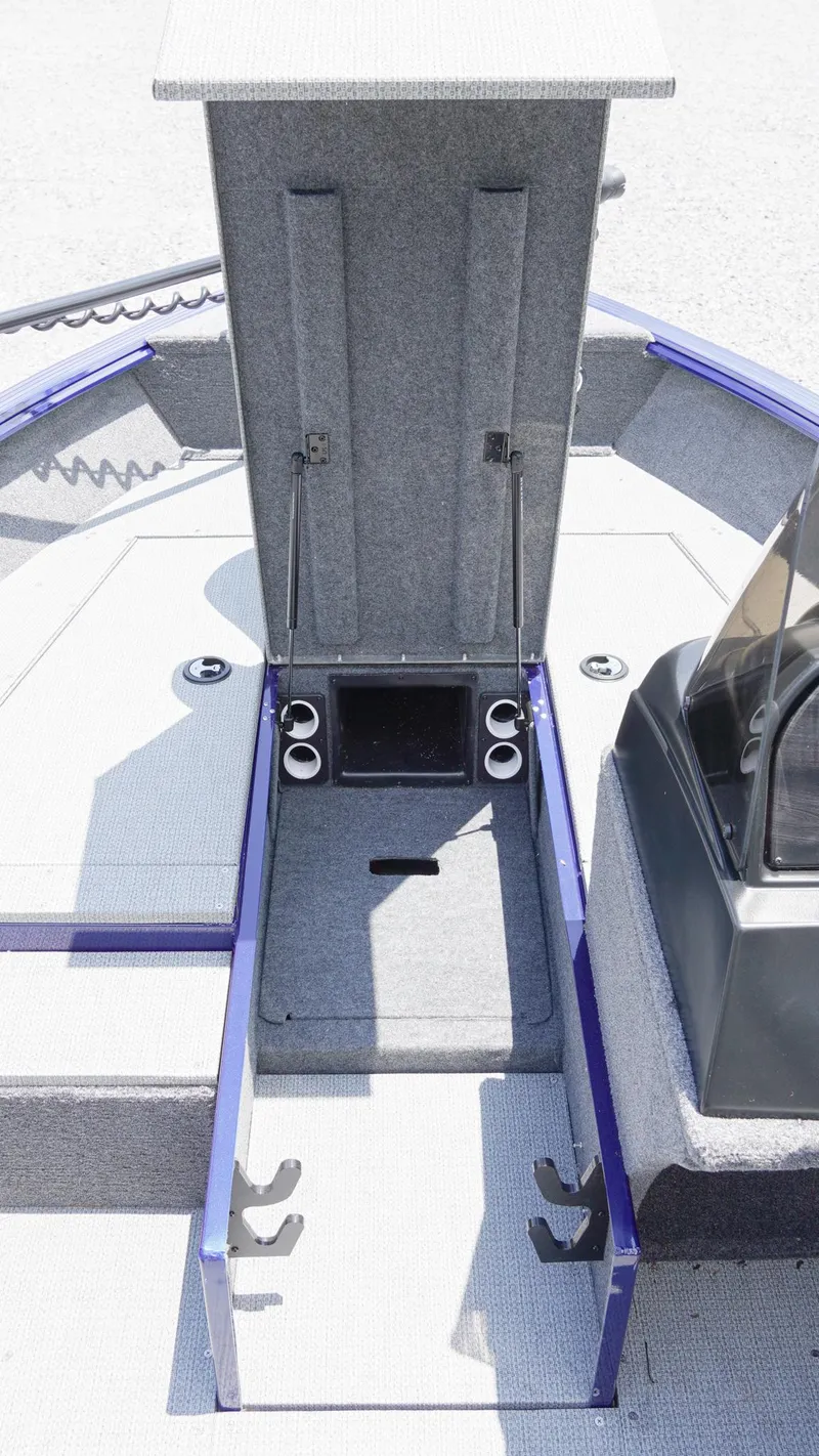 Slide: The Image of 2025 G3 Angler V164 C boat interior with open storage compartment. - 18