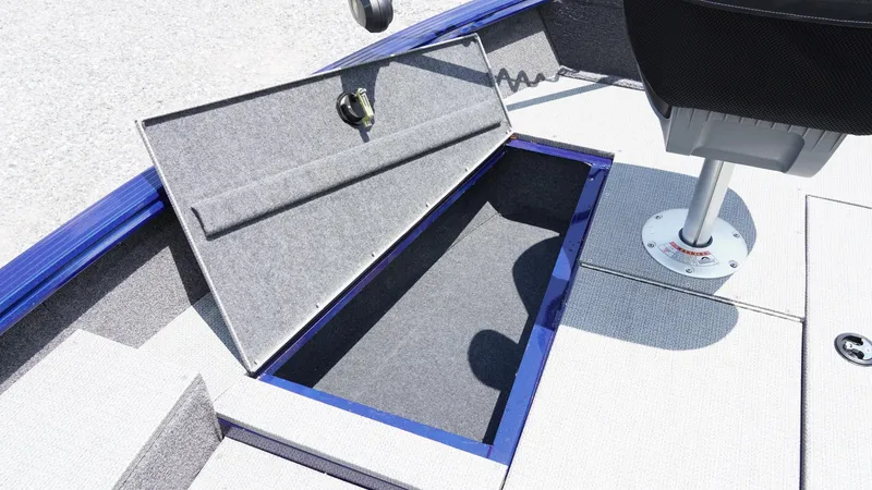 Slide: The Image of 2025 G3 Angler V164 C boat storage compartment with open lid and seating. - 19