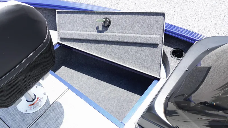 Slide: The Image of 2025 G3 Angler V164 C boat storage compartment with open lid and seat. - 20