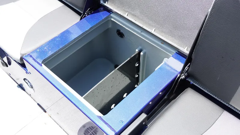 Slide: The Image of Open storage compartment in 2025 G3 Angler V164 C boat, featuring blue and gray seating. - 21