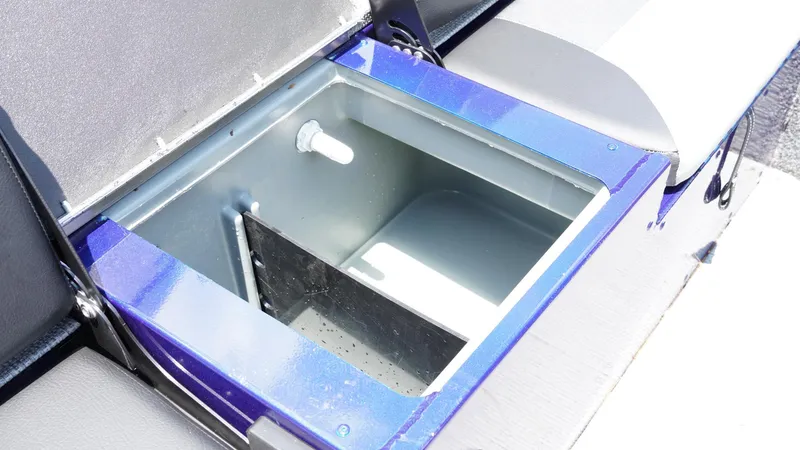 Slide: The Image of Open storage compartment in 2025 G3 Angler V164 C boat, featuring a sleek blue design. - 22