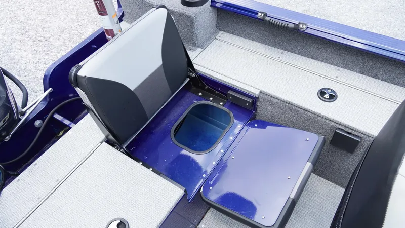 Slide: The Image of 2025 G3 Angler V164 C boat interior with open storage compartment and seating. - 25