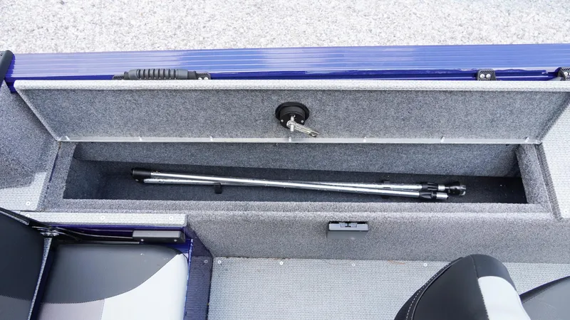 Slide: The Image of 2025 G3 Angler V164 C boat storage compartment with metal rods inside. - 26