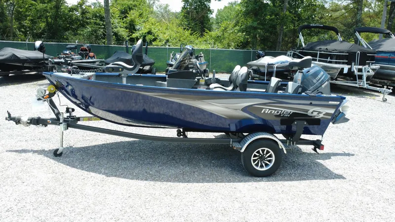 Slide: The Image of 2025 G3 Angler V164 C fishing boat on trailer, parked outdoors. - 3