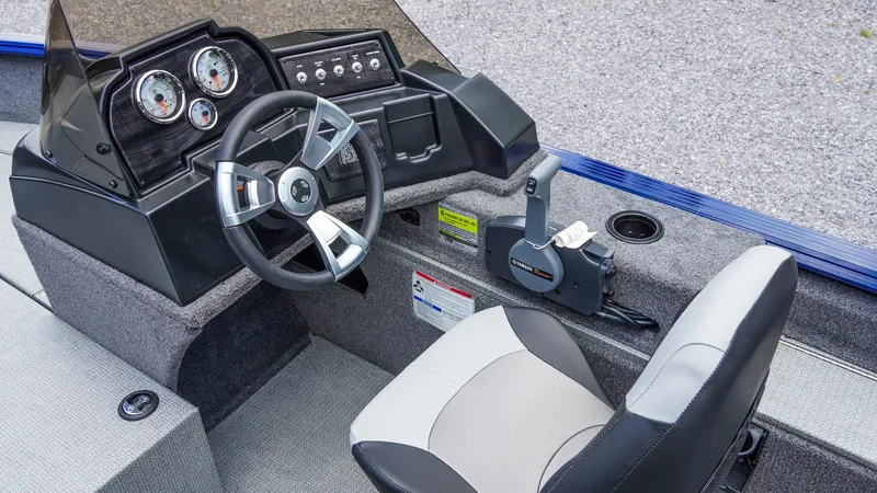 Slide: The Image of 2025 G3 Angler V164 C boat interior with steering wheel and control panel. - 31