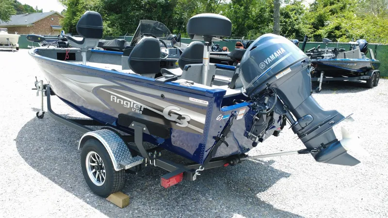 Slide: The Image of 2025 G3 Angler V164 C boat with Yamaha motor on trailer, parked outdoors. - 4
